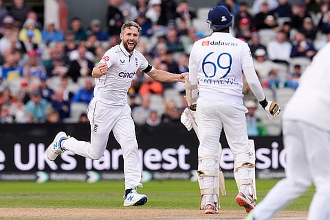 England vs Sri Lanka 1st Test, 3rd Day: England's Chris Woakes, left, celebrates taking the wicket of Sri Lanka's Angelo Mathews 